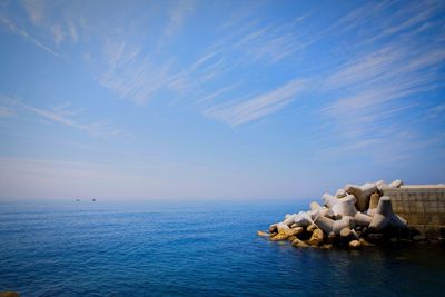 Scenic view of sea against blue sky