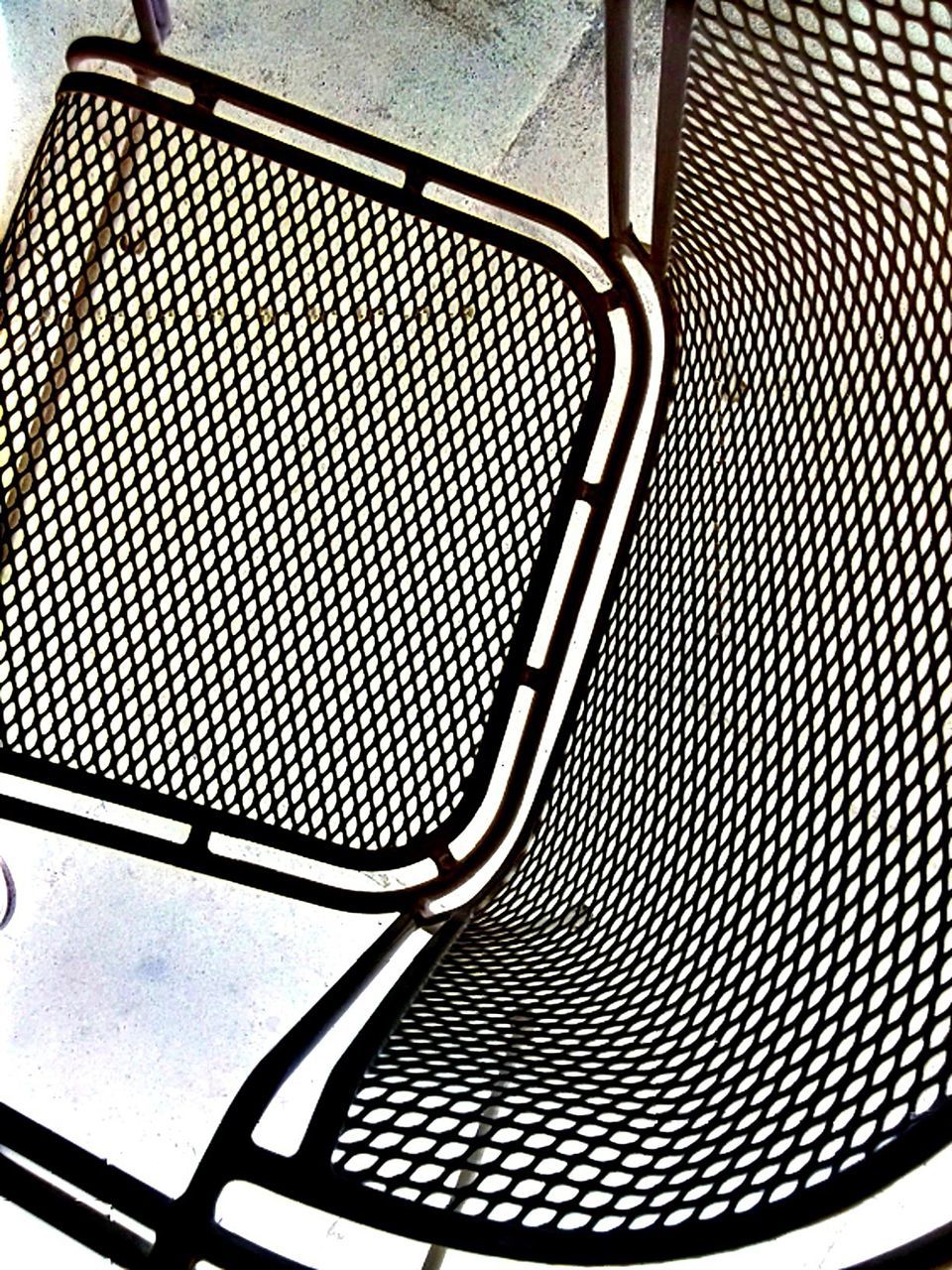 metal, pattern, metallic, indoors, close-up, design, protection, low angle view, railing, no people, safety, spiral, part of, day, full frame, modern, shape, backgrounds, security, shadow