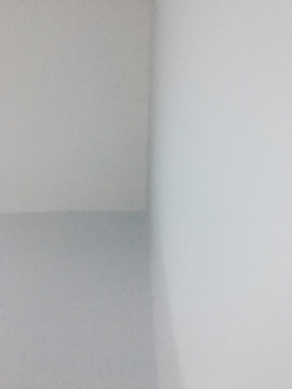 FULL FRAME SHOT OF WHITE WALL WITH EMPTY AND BLUE BACKGROUND