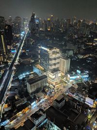 High angle view of illuminated city buildings at night