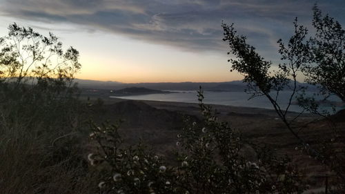 Scenic view of landscape against sky during sunset