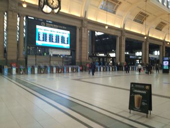 People waiting at railroad station platform