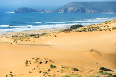 Scenic view of beach against sky