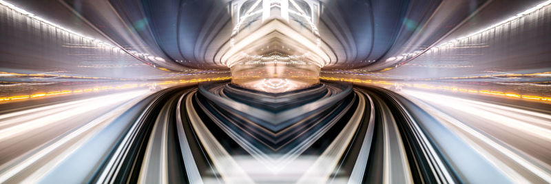 Light trails on railroad track at night