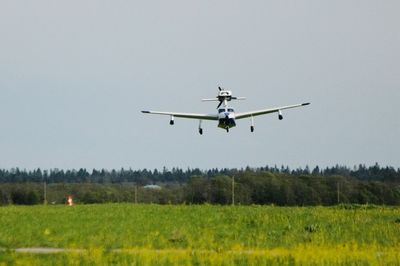 Low angle view of airplane flying in sky