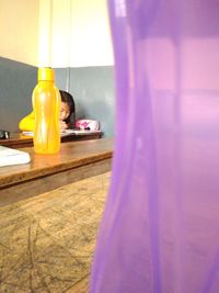 Close-up of glass bottle on table