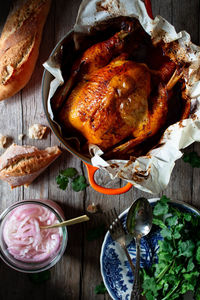 From above beautiful thanksgiving dinner with roasted chicken pollo pibil on wooden table