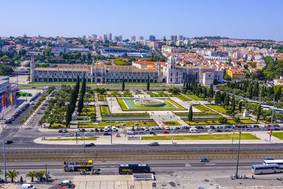 High angle view of city street and buildings against sky