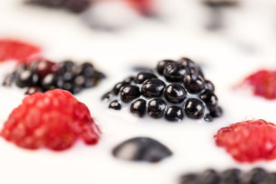 Close-up of strawberry over white background