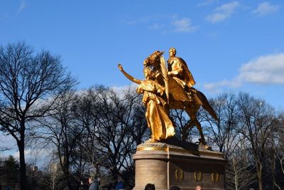 Low angle view of statue against sky