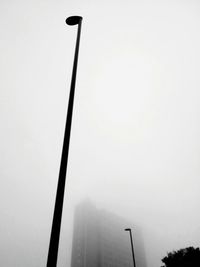 Low angle view of street light against sky