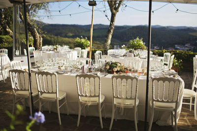 Empty chairs and tables at restaurant