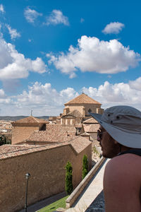 Rear view of woman wearing hat against sky