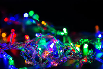 Close-up of illuminated lights at night