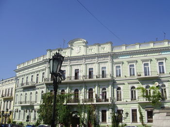 Low angle view of building against blue sky