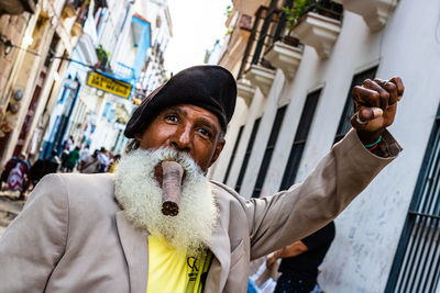 Portrait of man standing in city