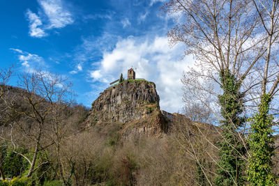 Low angle view of rock formations against sky