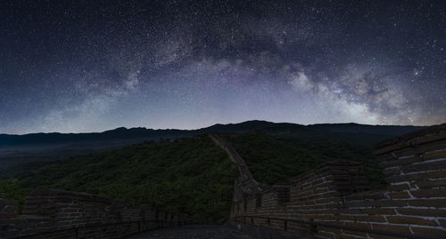 Scenic view of milky way over great wall of china