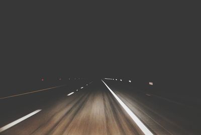 Illuminated road at night