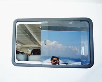 Portrait of woman seen through glass window