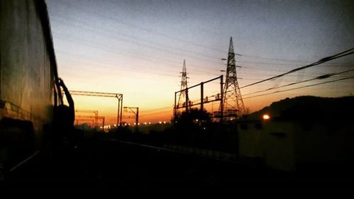 Electricity pylons at sunset