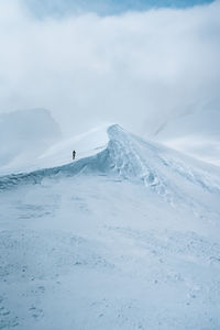 Scenic view of snowcapped mountain against sky