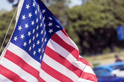 Close-up of flag against blue sky