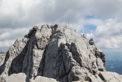 Low angle view of rock formation against sky