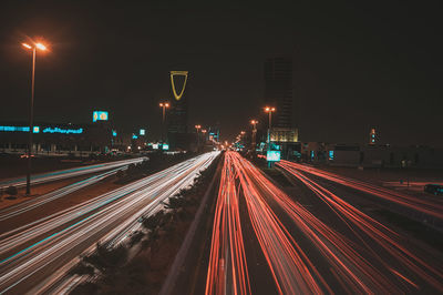 High angle view of light trails on highway at night