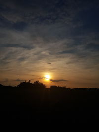 Scenic view of silhouette landscape against sky during sunset