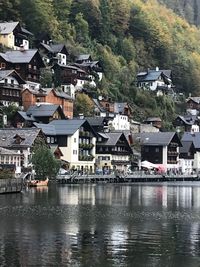 Houses by river in town