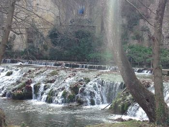 Scenic view of river flowing through rocks