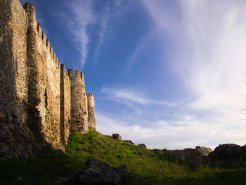 Low angle view of old ruin against sky