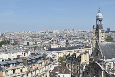 High angle view of city buildings against sky