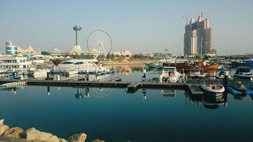 Boats moored at harbor