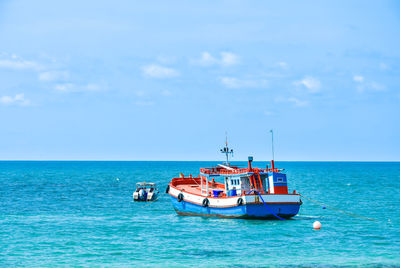 Boat in sea against sky