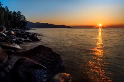 Scenic view of sea against sky during sunset