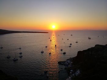 Scenic view of sea against clear sky during sunset