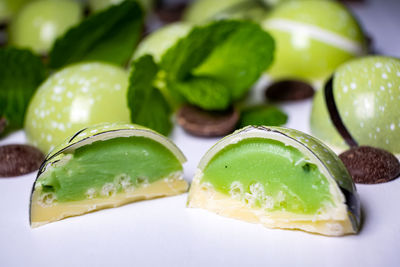 Close-up of green fruits in plate on table