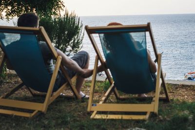 Man sitting on chair at playground