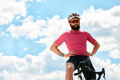 Low angle view of man riding bicycle