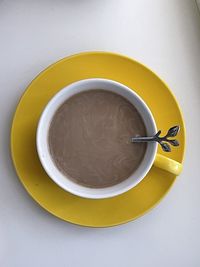 Directly above shot of coffee cup on table