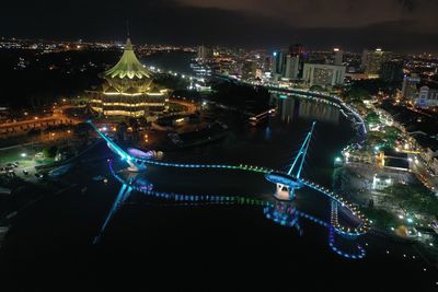 High angle view of illuminated city buildings at night