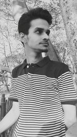 Portrait of young man standing outdoors