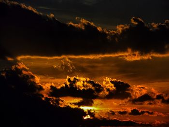 Scenic view of dramatic sky at sunset