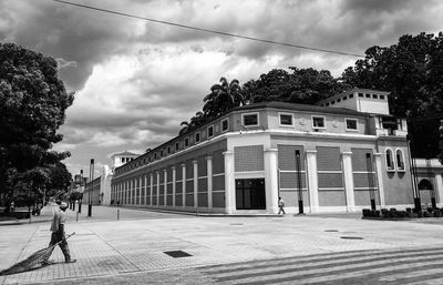 Street by building against sky