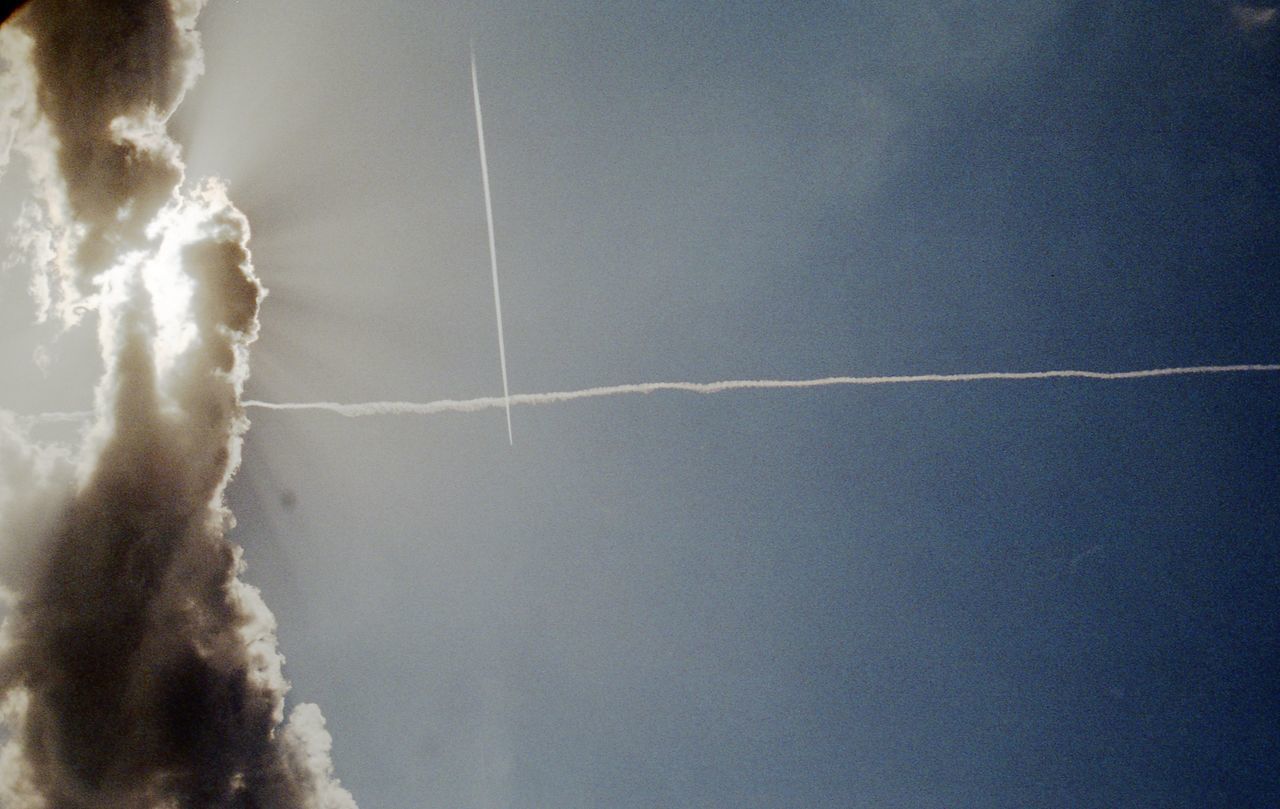 LOW ANGLE VIEW OF VAPOR TRAIL IN THE SKY