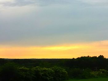 Scenic view of landscape against cloudy sky