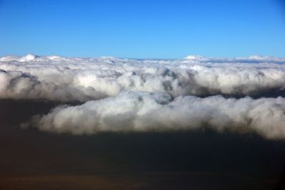 Scenic view of landscape against blue sky