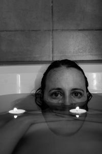 Portrait of young woman in bathroom